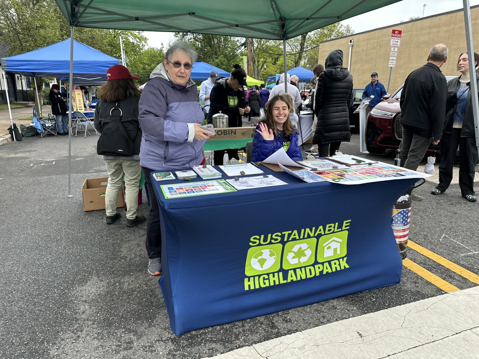 SHP table with information on it and two members staffing it.