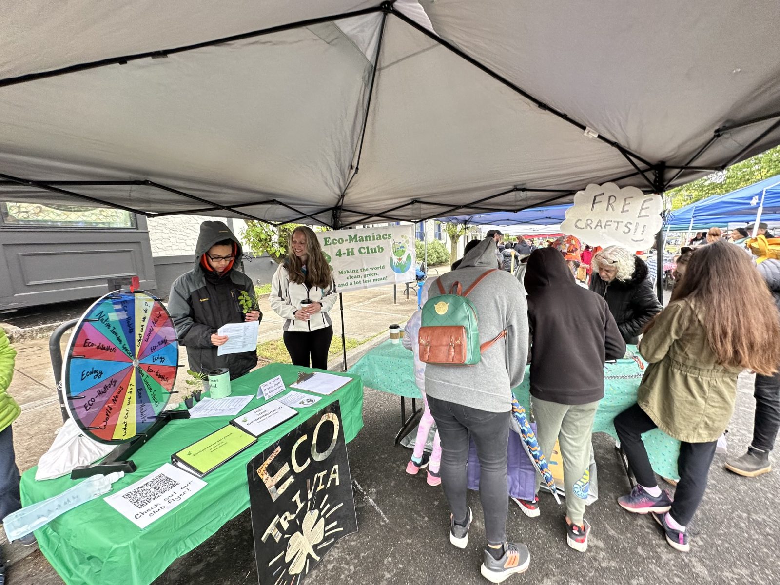 4-H EcoManiacs tent with trivia and crafts.