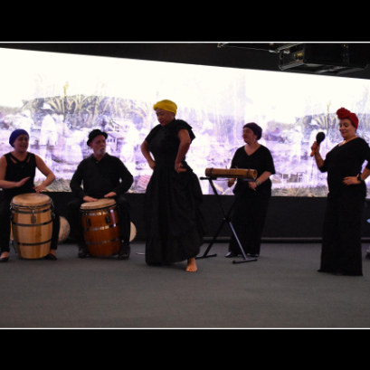 Five members of Raices during a performance.