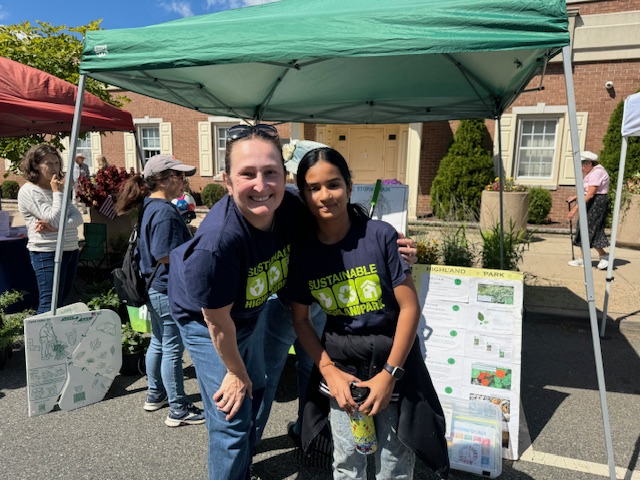 SHP member and student posting at Earth Day.