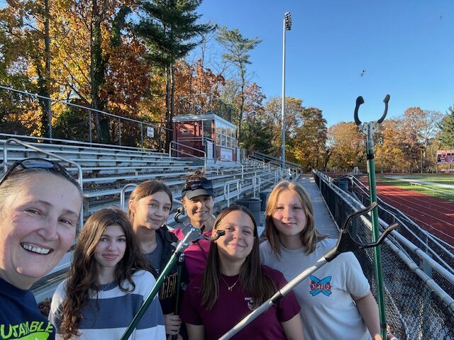 Students prepared to start a school cleanup.